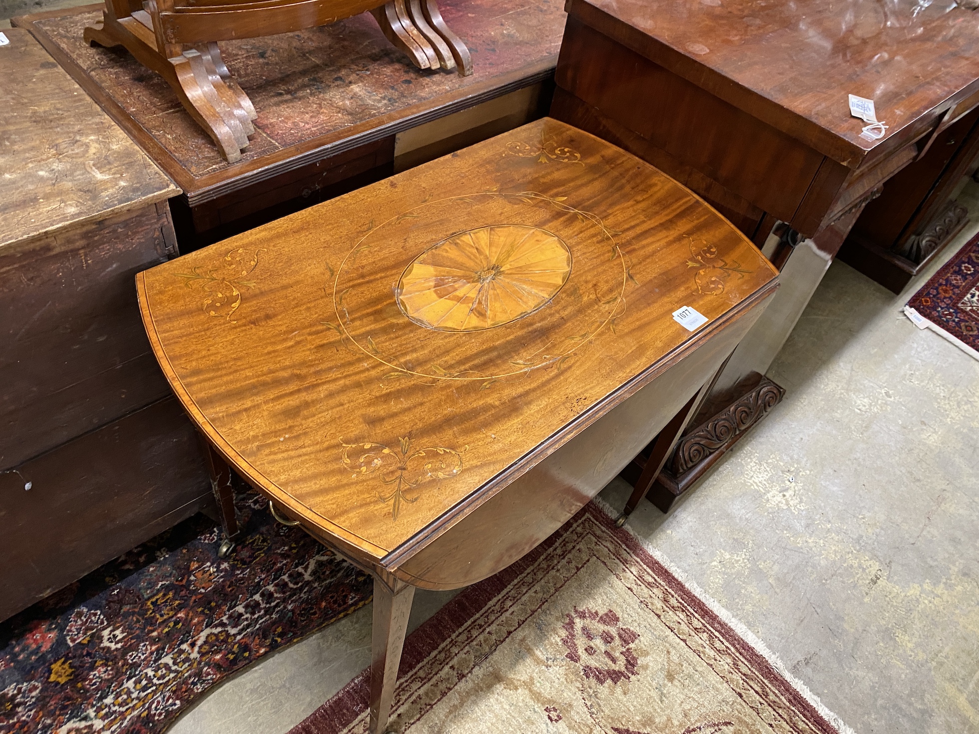 A George III marquetry inlaid oval mahogany Pembroke table, width 85cm, depth 52cm, height 72cm